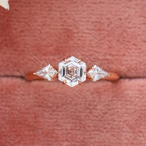 hexagon cut lab diamond three stone engagement ring in jewelry box