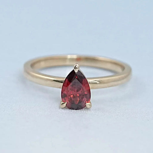 front view of garnet pear-cut gemstone solitaire engagement ring