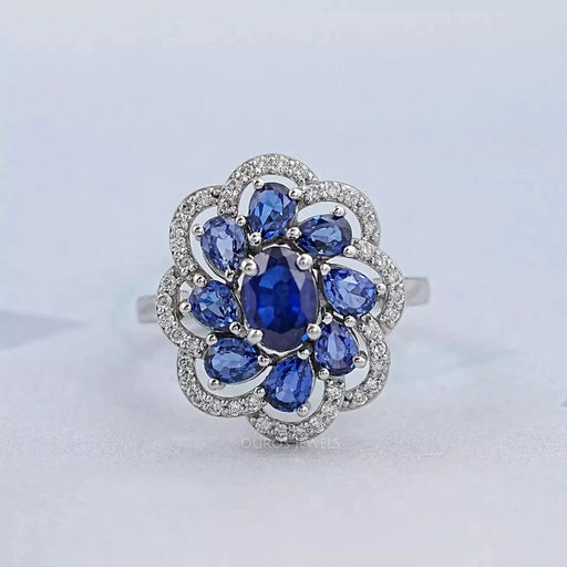 blue sapphire oval diamond floral halo engagement ring's front view