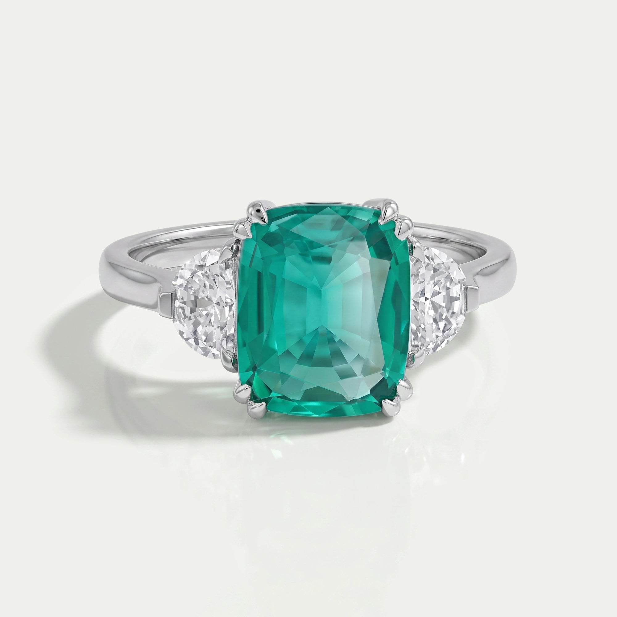 Green Cushion And Half Moon Trio Engagement Ring