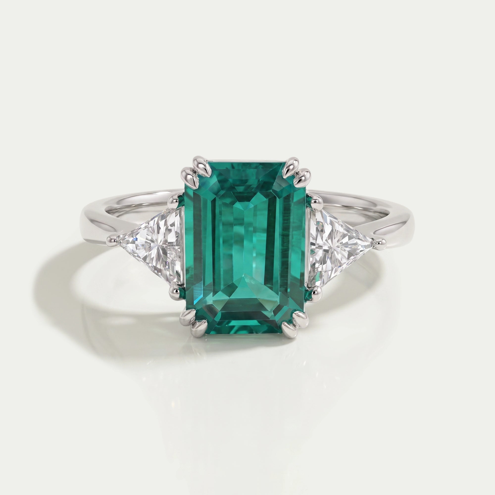 Emerald And Triangle Cut Trio Engagement Ring