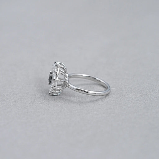 princess cut diamond dutch marquise halo engagement ring's side view on grey fabric