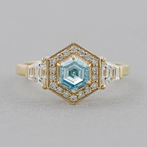 front view of blue hexagon-cut lab diamond halo 3-stone colored engagement ring