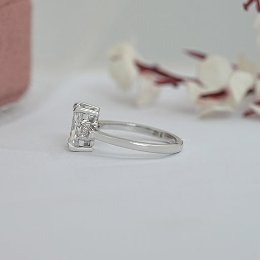 brilliant radiant cut and tapered baguette three stone wedding ring's side view