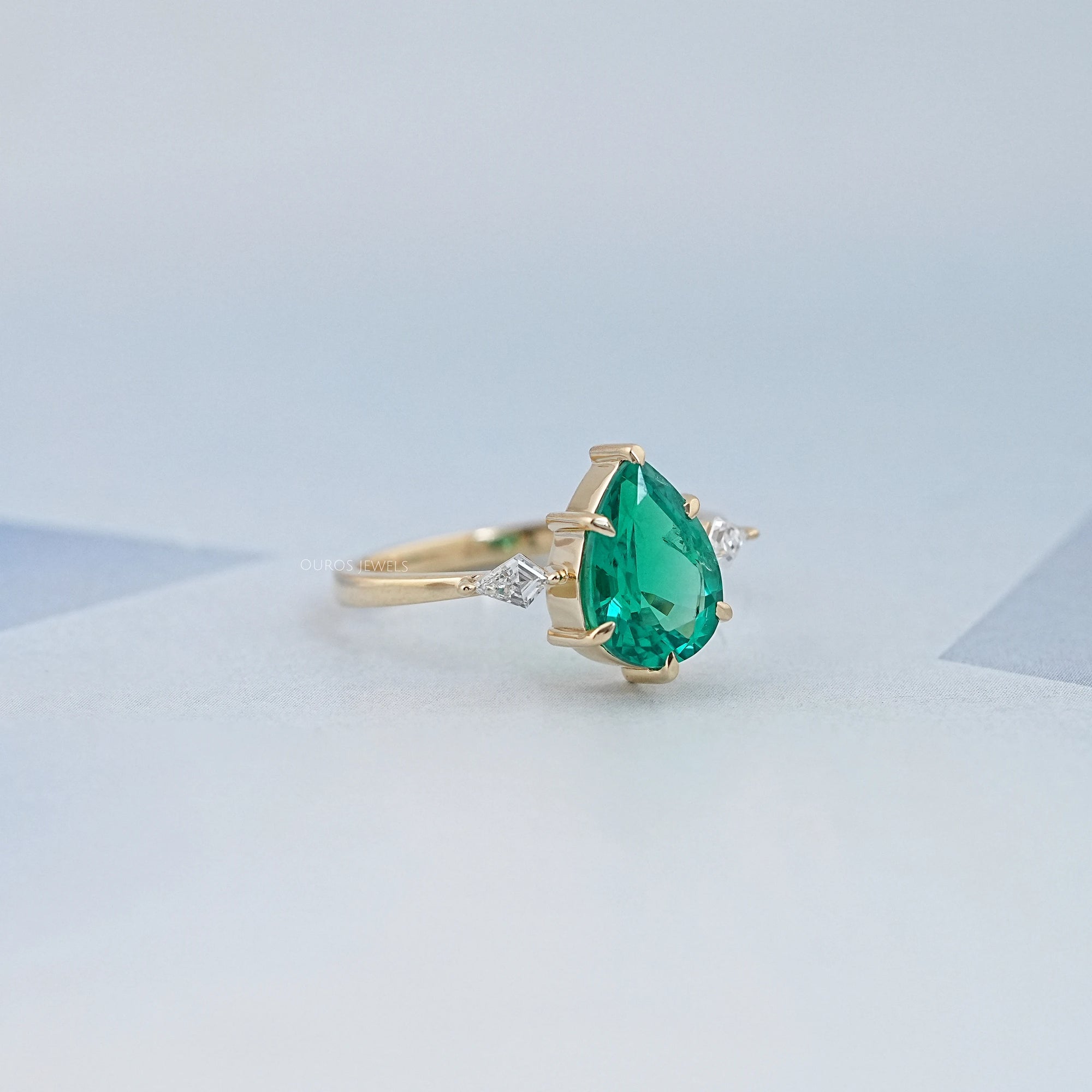 Green Pear And Kite Cut Three Stone Engagement Ring