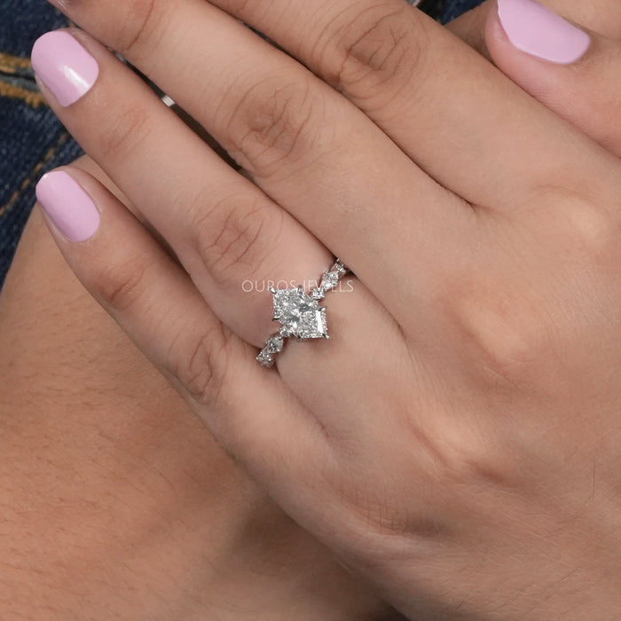 dutch marquise cut and solitaire accent diamond engagement ring on model's finger