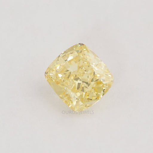 front view of yellow cushion shaped loose lab grown diamond