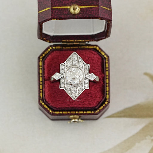 old european round cut diamond bezel set engagement ring in jewelry box