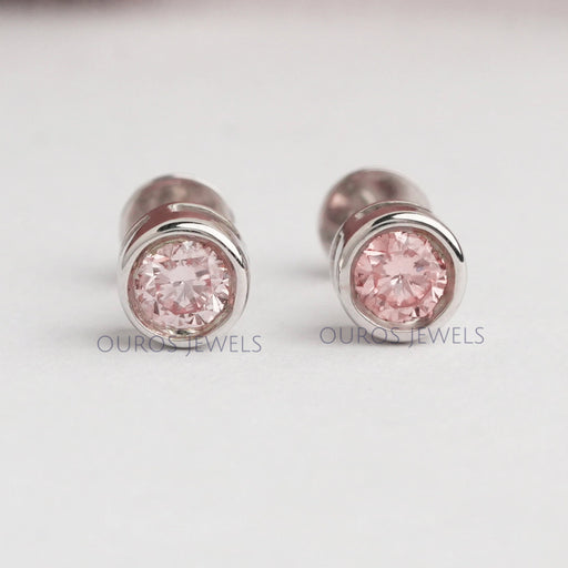 front view of pink round lab grown diamond bezel set stud earrings rose gold