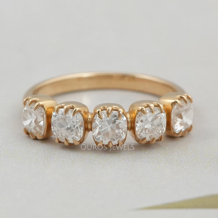 front view of old mine cushion cut five stone wedding ring with yellow gold band