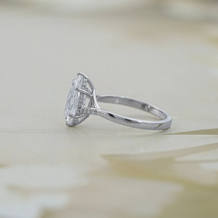 side view of old mine moval cut lab diamond split shank wedding ring on grey fabric
