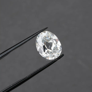 oval cut lab created diamond holded with tweezer