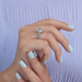 [On finger side view of vintage style old mine cut diamond halo engagement ring]-[Ouros Jewels]