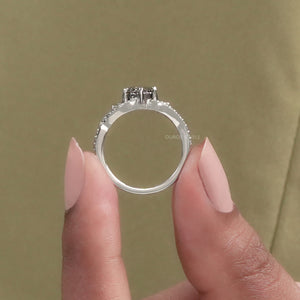 A Women showing Olive Round Diamond Ring 