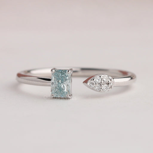 front view of green radiant-cut lab diamond open cuff dainty wedding band on fabric