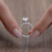 close view of oval-cut lab-grown diamond solitaire accent engagement ring
