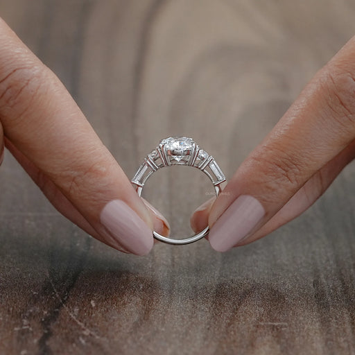 close view of oval and half moon cut diamond five stone engagement ring