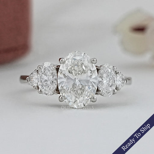 front view of oval and trillion cut lab diamond five stone engagement ring