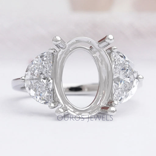 front view of oval-shaped and half-moon diamond semi-mount engagement ring