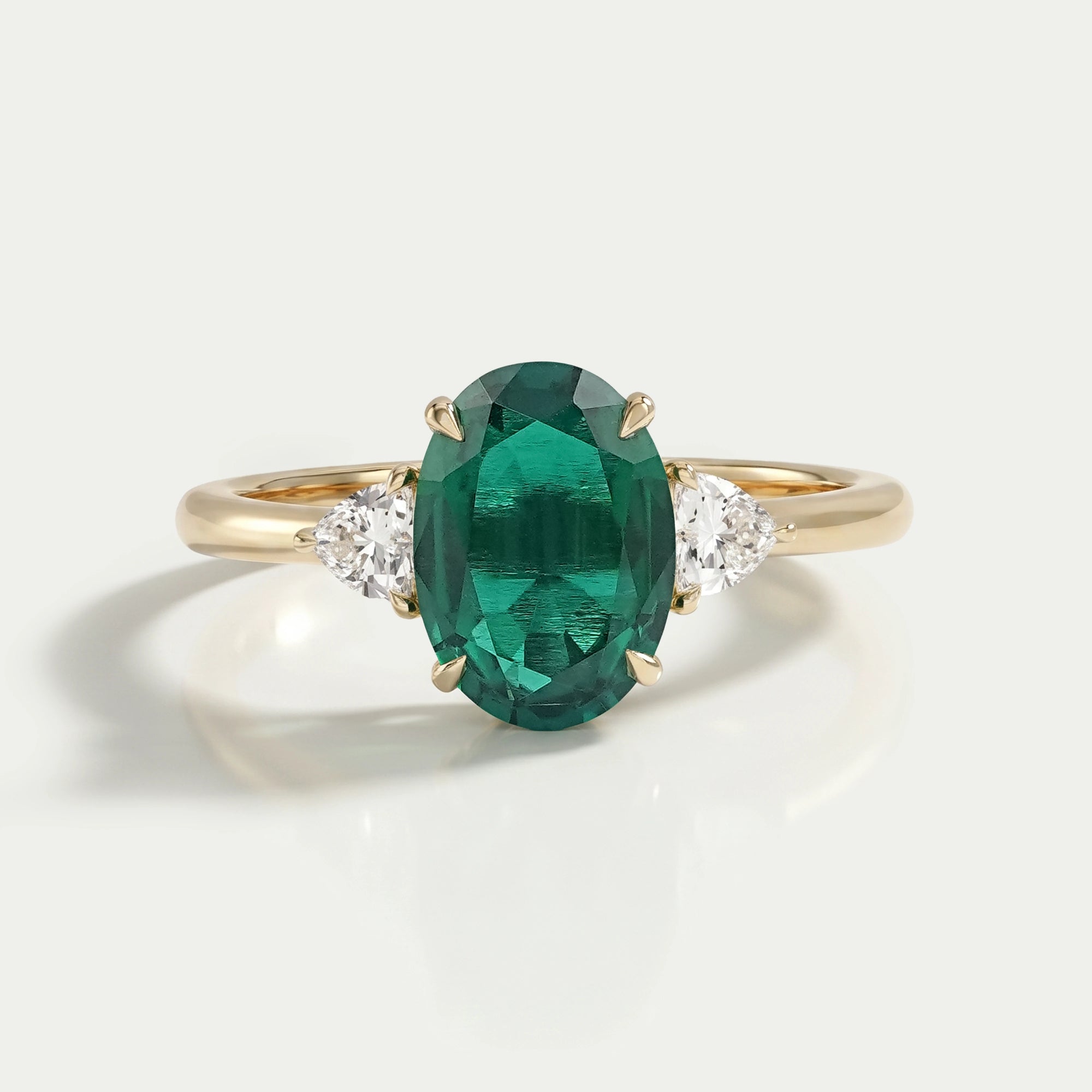 Trilogy Zambian Green Oval Gemstone And Trillion Cut Ring