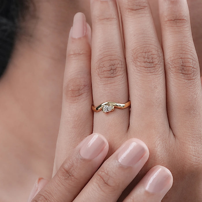 Pear Cut Diamond And Wave Gold Anniversary Ring
