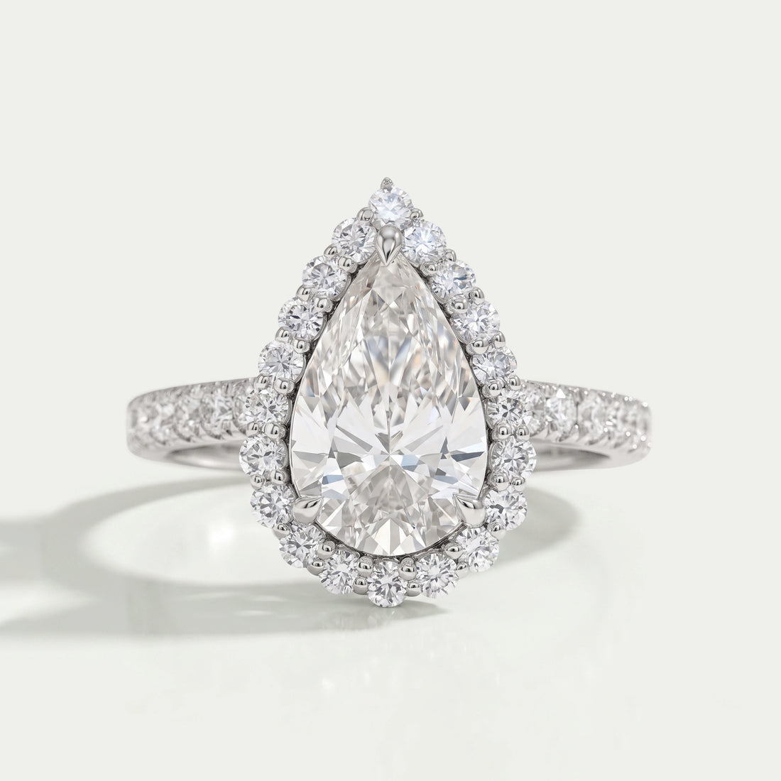 Pear Cut Halo Solitaire Accent Engagement Ring