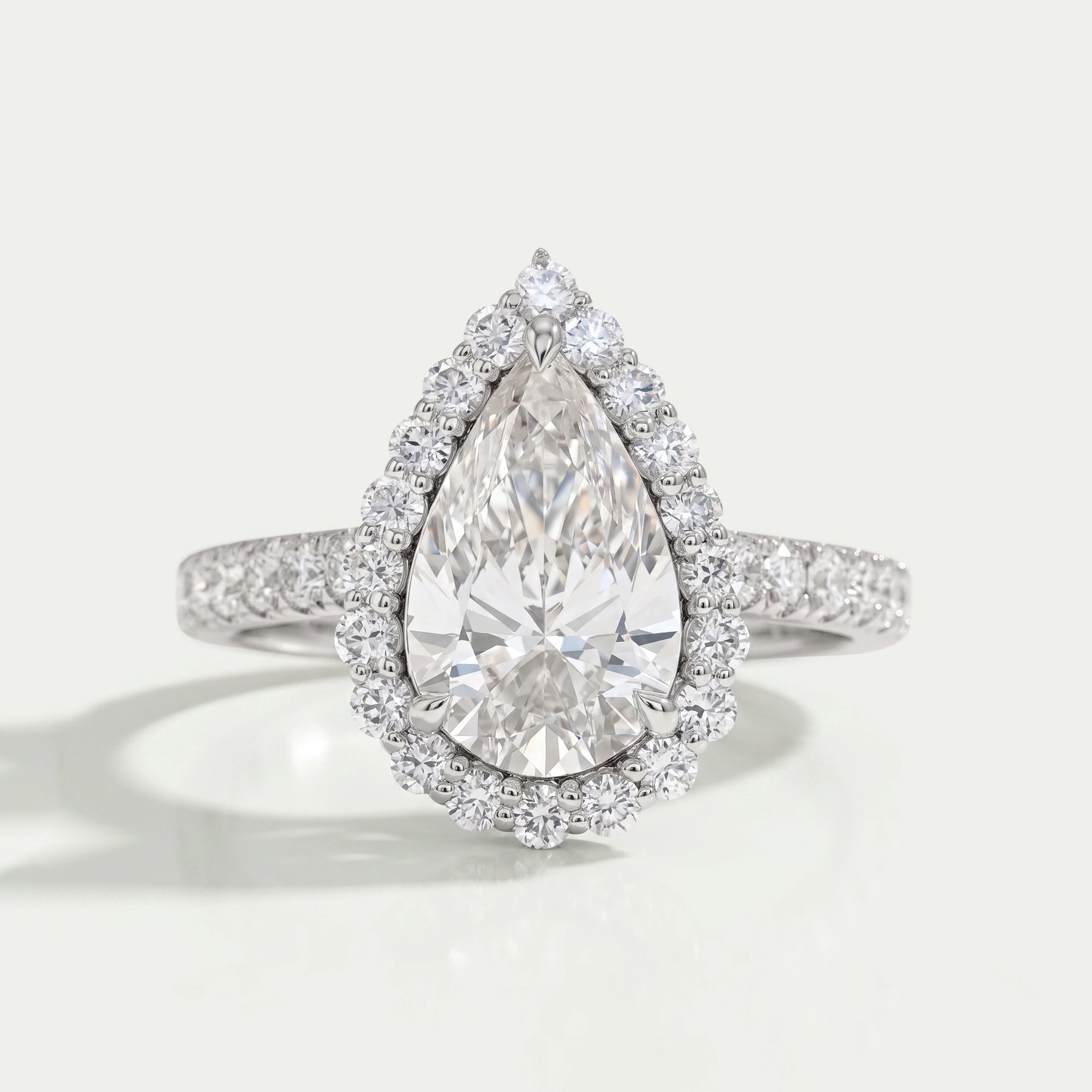Pear Cut Halo Solitaire Accent Engagement Ring