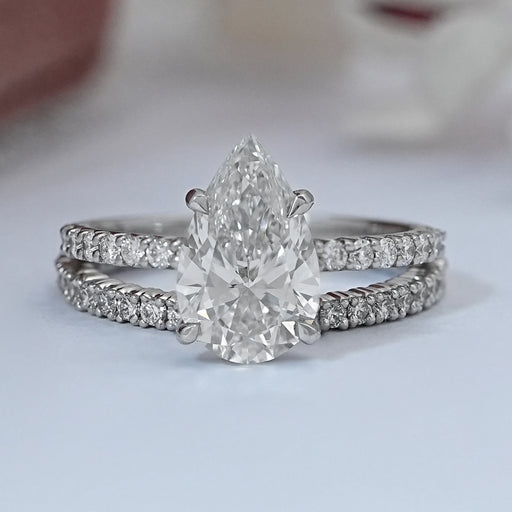 front view of pear-cut diamond solitaire bridal ring set with white gold band