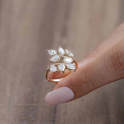 side view of pear-cut lab diamond leaf design cluster engagement ring