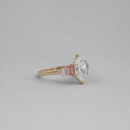 side view of dutch marquise cut with baguette diamond engagement ring on fabric