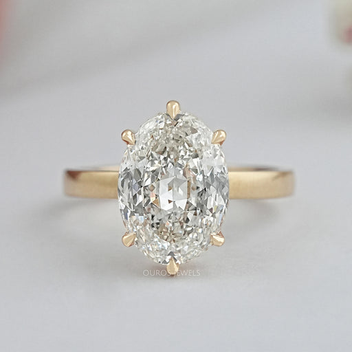 top view of portuguese oval cut lab diamond 6 prong engagement ring