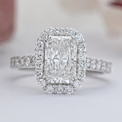 radiant cut lab diamond halo engagement ring's front view angle on grey fabric