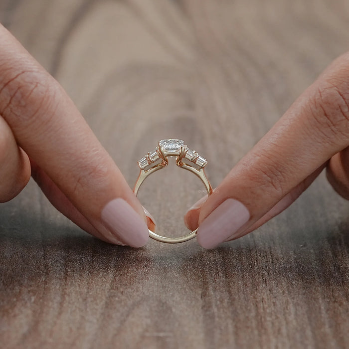 close view of radiant and baguette cut lab diamond five stone engagement ring