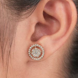 Round Brilliant Cut Diamond Halo Stud Earrings worn on an ear, showcasing their sparkling design and elegance.