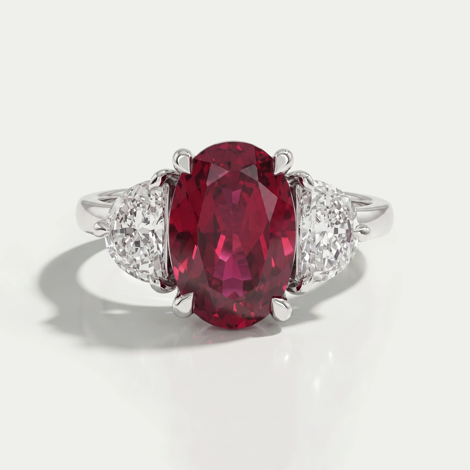 3 Stone Oval Ruby And Half Moon Diamond Ring