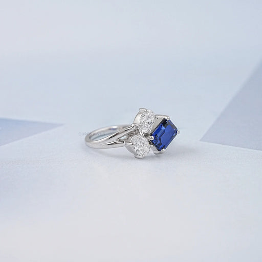right view of sapphire emerald and oval cut diamond split shank engagement ring