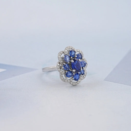 blue sapphire oval diamond floral halo engagement ring's side view