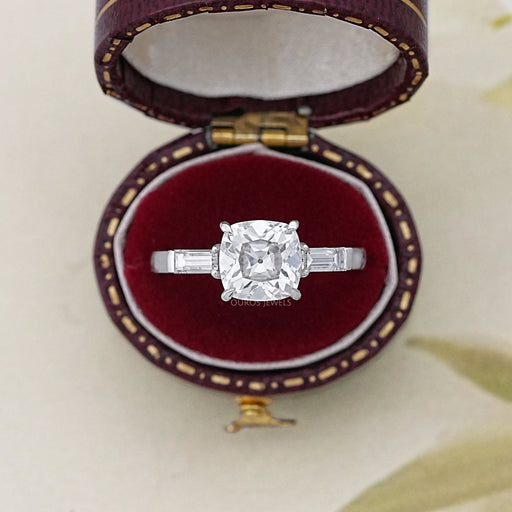 square old mine cushion cut diamond three stone engagement ring in jewelry box