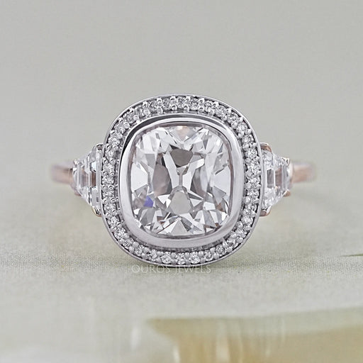 square old mine cushion diamond halo engagement ring's front view on grey fabric