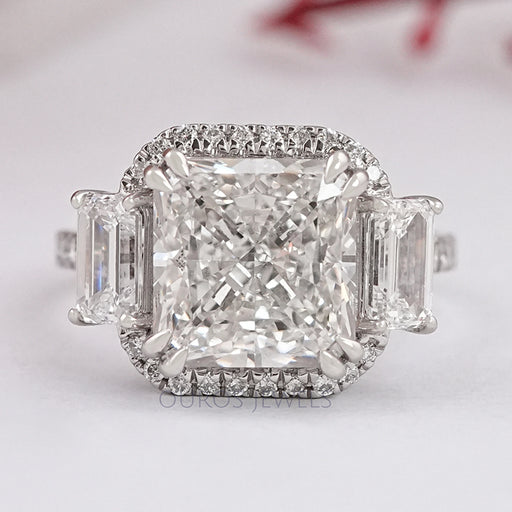 front view of square radiant cut diamond with halo accent three stone ring