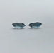 side view of step cut blue oval shaped lab created diamonds pair