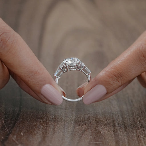 close view of trapezoid and round lab diamond five stone wedding band