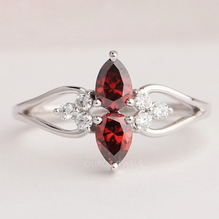 front view of red pear-cut lab diamond two-stone dainty colored wedding band