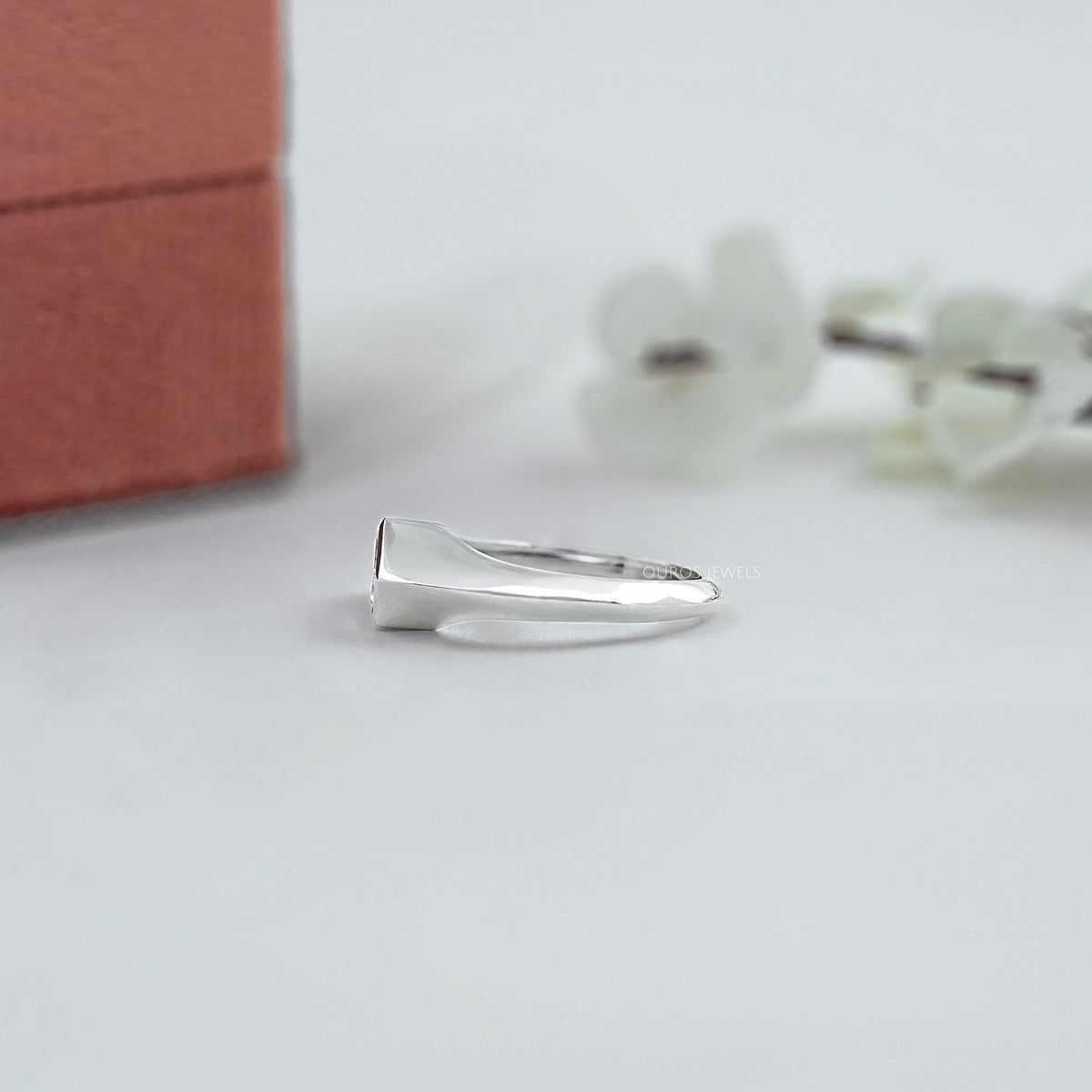East West Step Cut Shield Bezel Set Solitaire Ring
