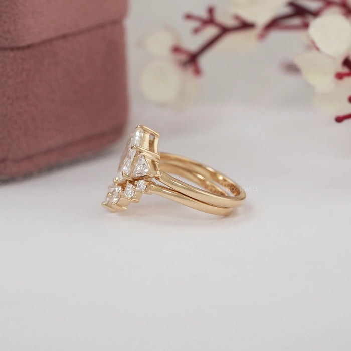 side view of antique hexagon-cut lab diamond curved three-stone bridal ring set