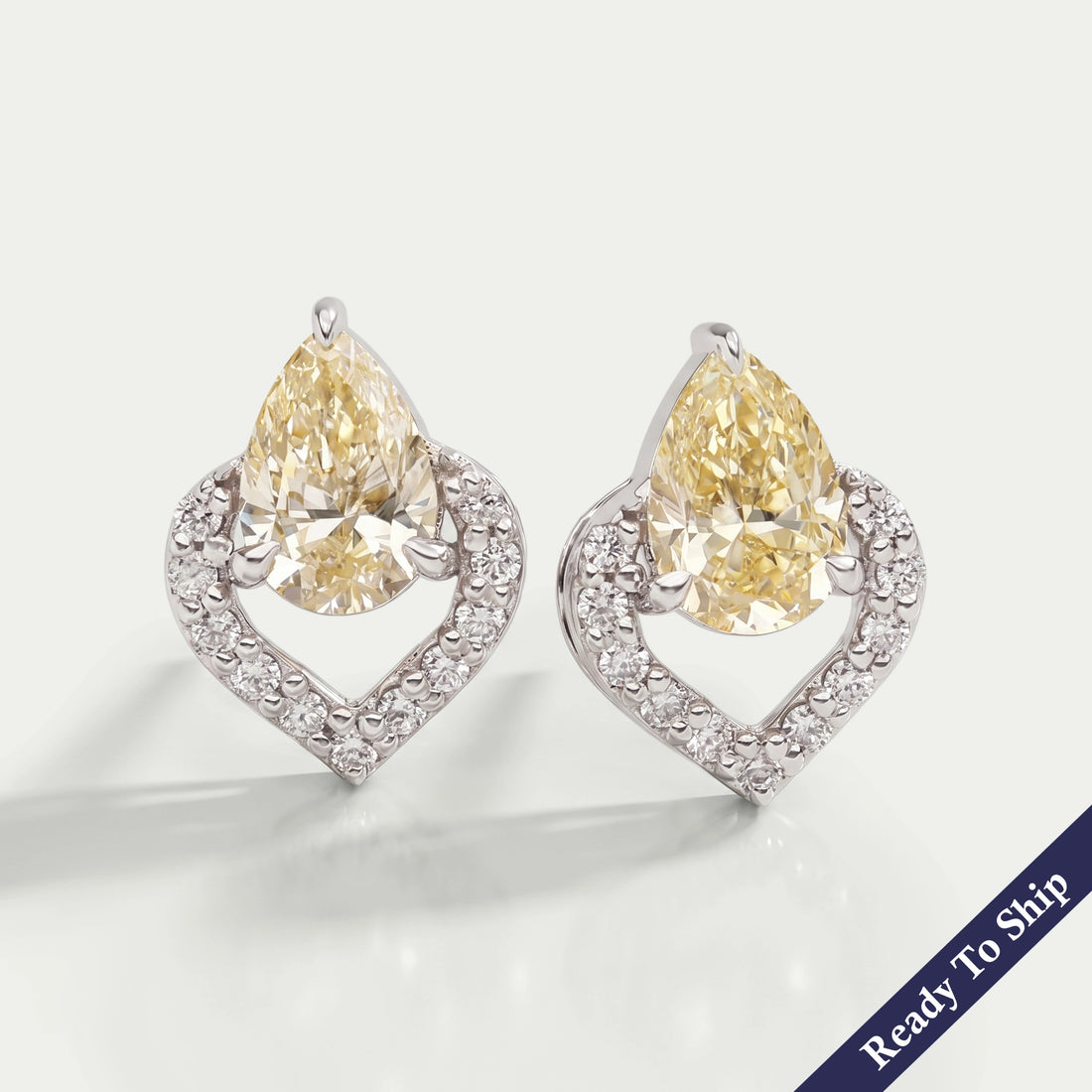 Yellow Pear Cut Halo Stud Earrings