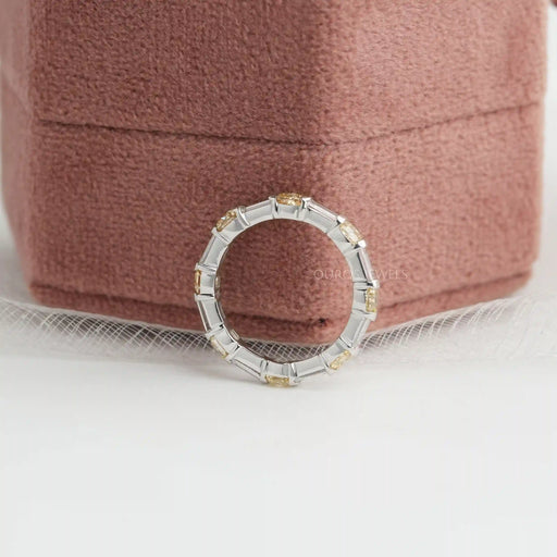 side view yellow cushion and baguette man made diamond eternity band white gold