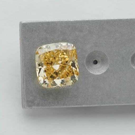 brilliant yellow cushion cut lab created diamond loose on matte material