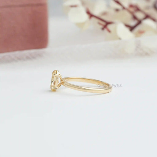 side view of yellow oval cut lab diamond engagement ring