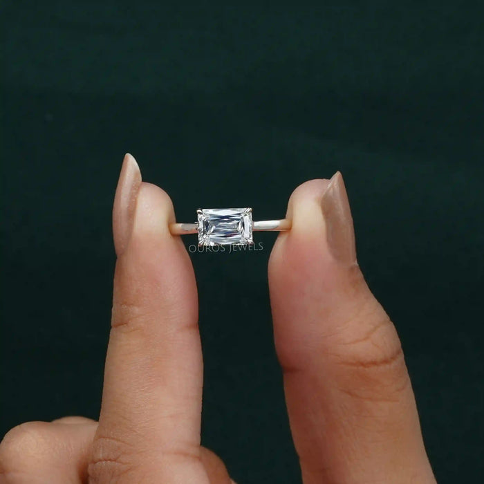 close up view of east west criss cut lab diamond engagement ring